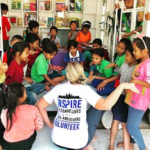 Volunteer reading to children